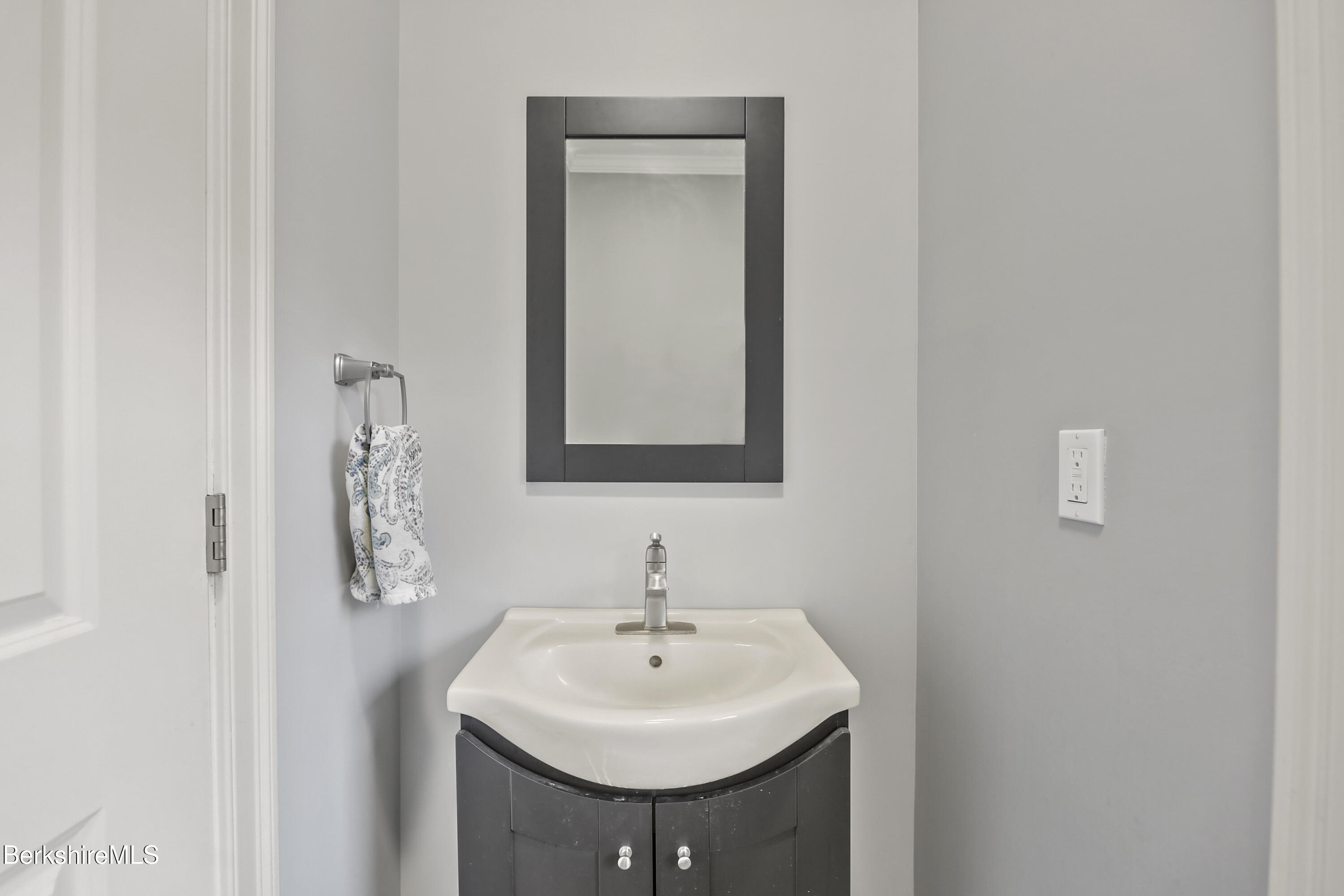 2012 East Otis Road Otis, MA 01029 - Photo 27 of 53 a bathroom with a sink and a mirror