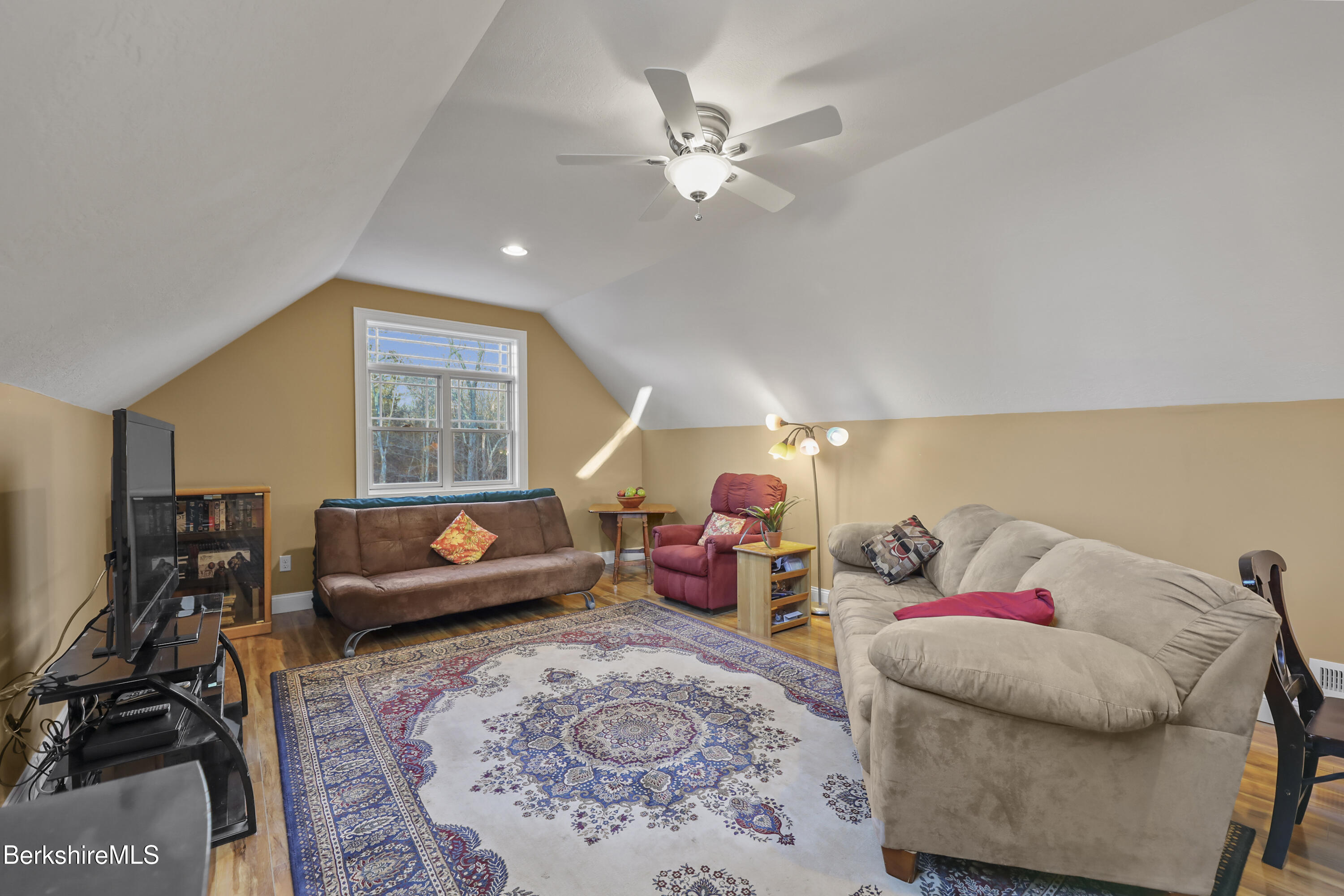 2012 East Otis Road Otis, MA 01029 - Photo 29 of 53 a living room with furniture a window and a flat screen tv