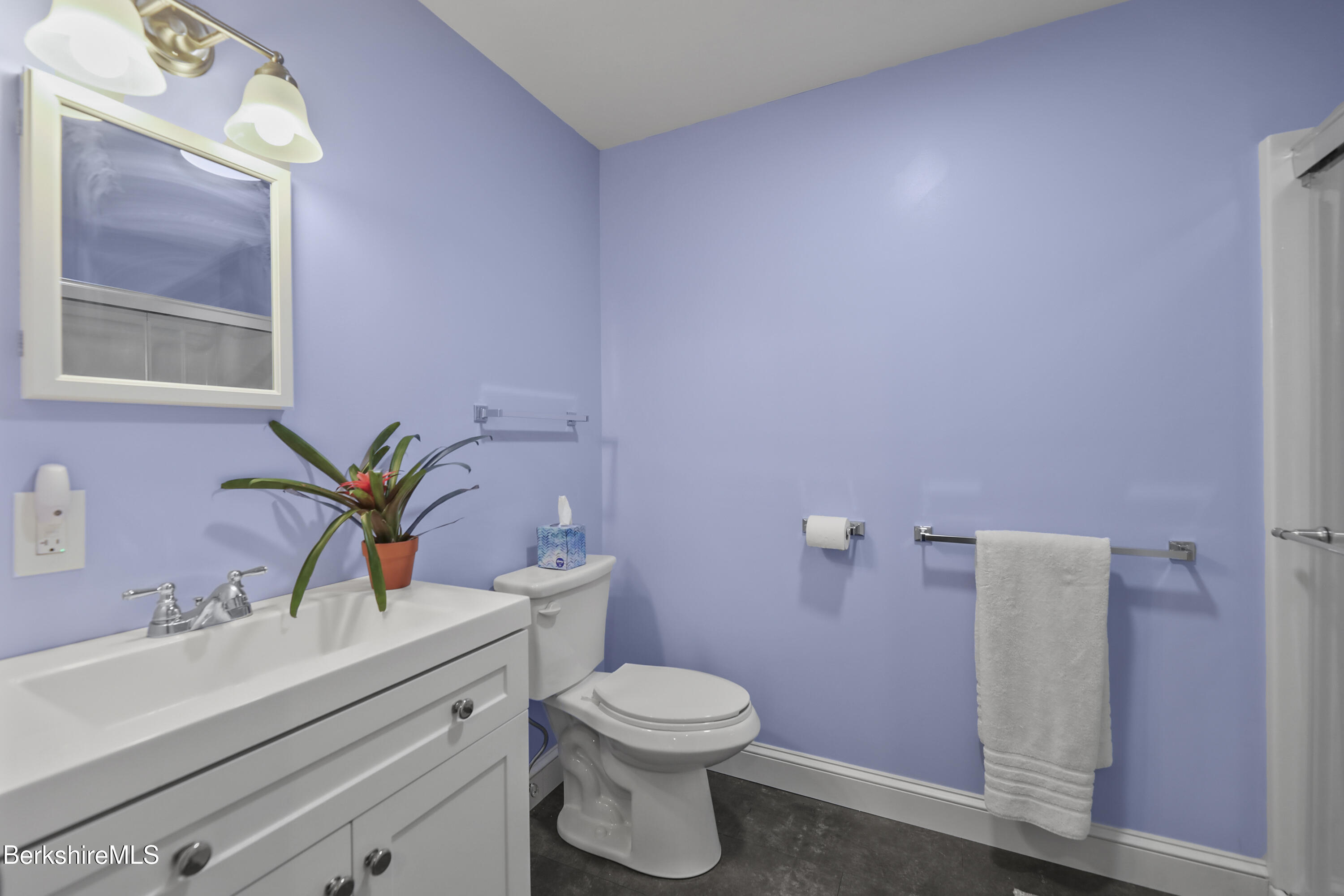 2012 East Otis Road Otis, MA 01029 - Photo 37 of 53 a bathroom with a sink a toilet and mirror