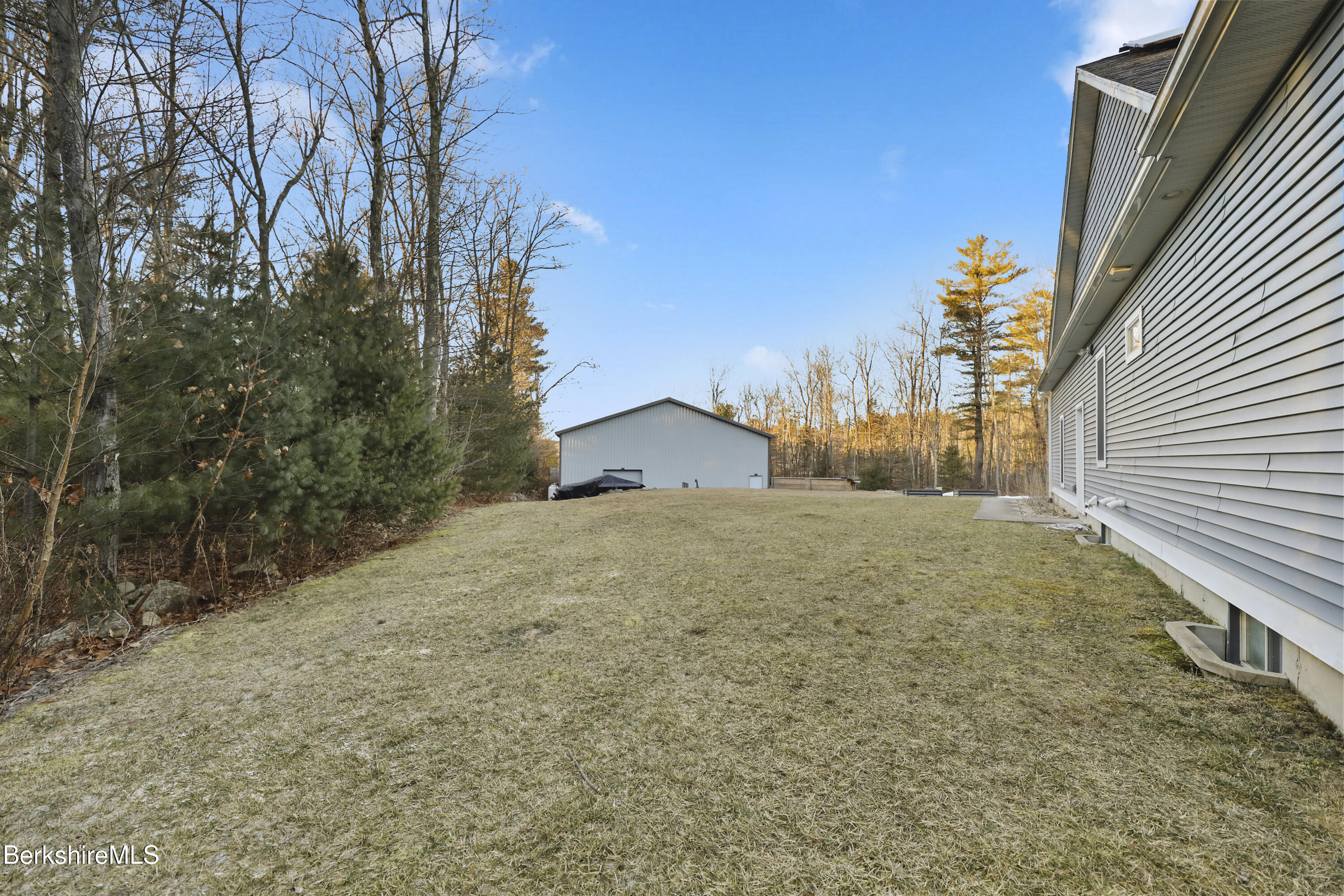 2012 East Otis Road Otis, MA 01029 - Photo 46 of 53 a yellow house with trees in front of it