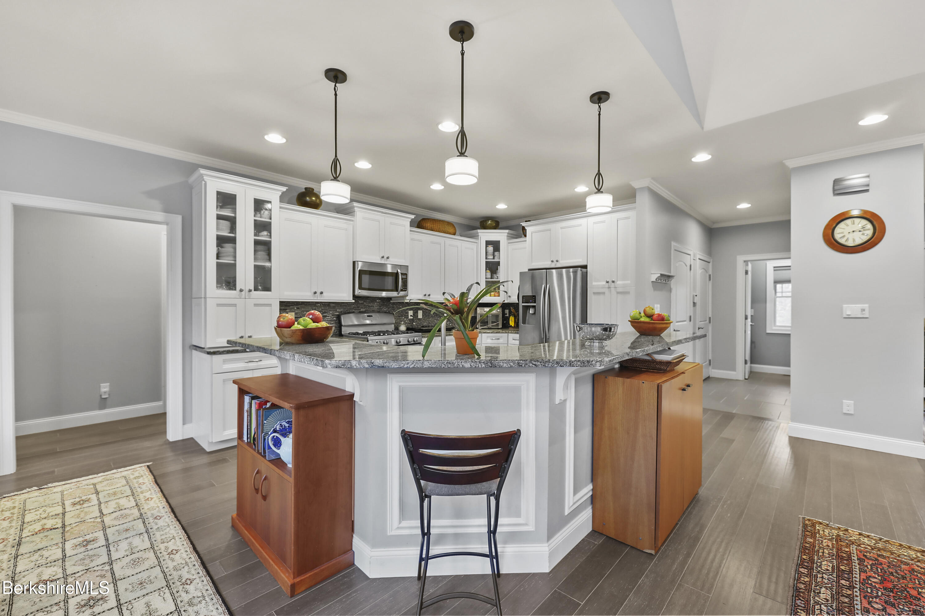 2012 East Otis Road Otis, MA 01029 - Photo 9 of 53 a kitchen with stainless steel appliances granite countertop a refrigerator a oven a sink and a dining table with wooden floor