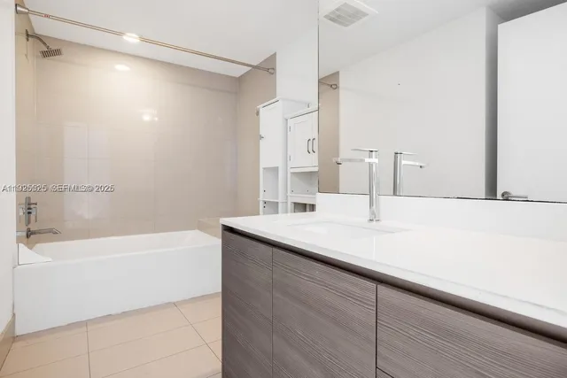 a bathroom with a sink and a bathtub