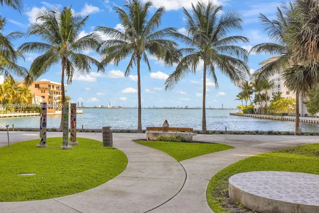 a swimming pool with outdoor seating