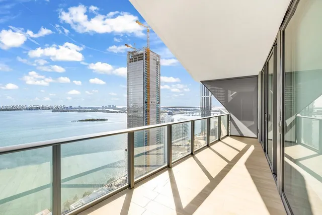 a view of an empty room with glass windows