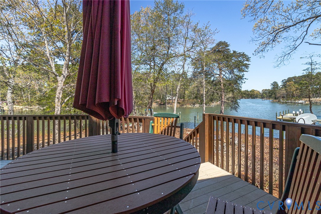 176 Baypointe Court Reedville, VA 22539 - Photo 12 of 60 a view of a wooden deck with a yard