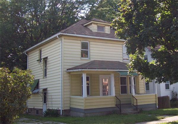 380 Nottingham Street Springfield, MA 01104 - Photo 1 of 18 a front view of a house with a garden