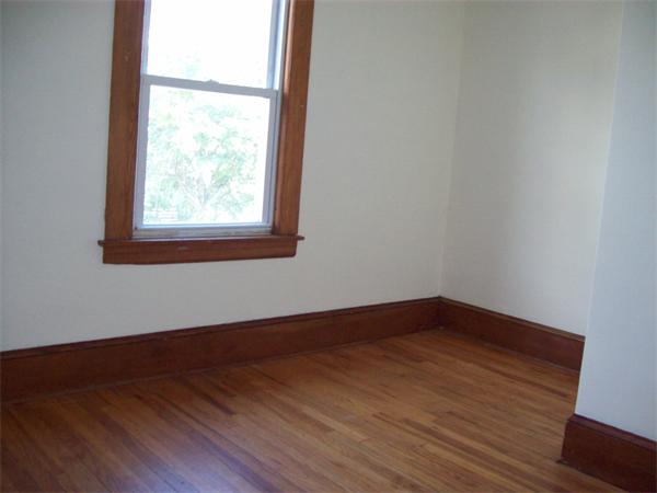 380 Nottingham Street Springfield, MA 01104 - Photo 16 of 18 an empty room with wooden floor and windows