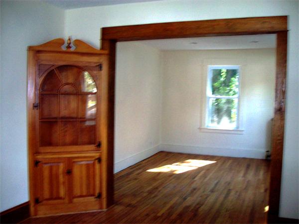 380 Nottingham Street Springfield, MA 01104 - Photo 4 of 18 a view of empty room with wooden floor and fan