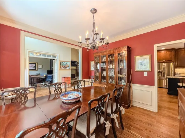 a kitchen with stainless steel appliances granite countertop sink stove and refrigerator