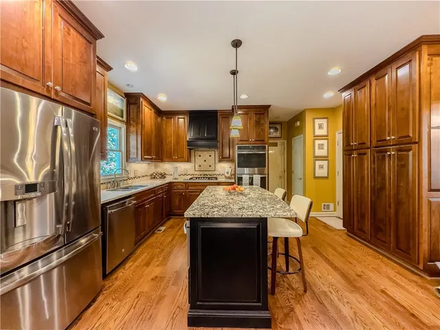 a work room with furniture windows and a flat screen tv