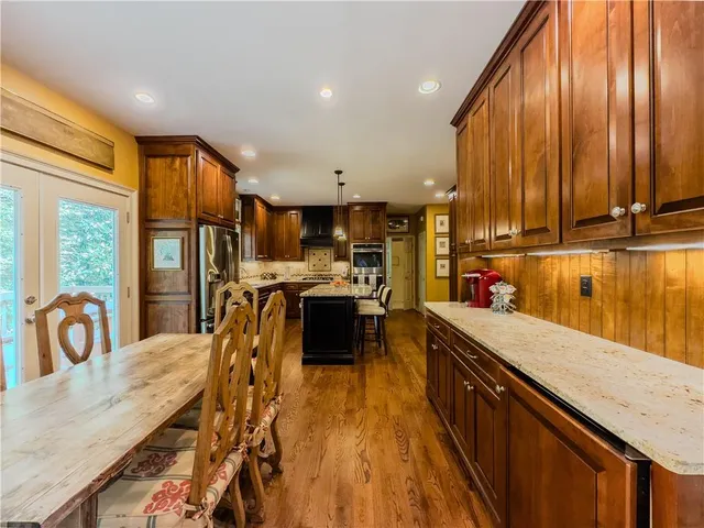 a bathroom with a sink mirror and toilet