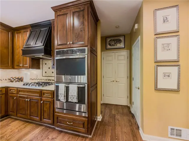 a living room with furniture fireplace and flat screen tv
