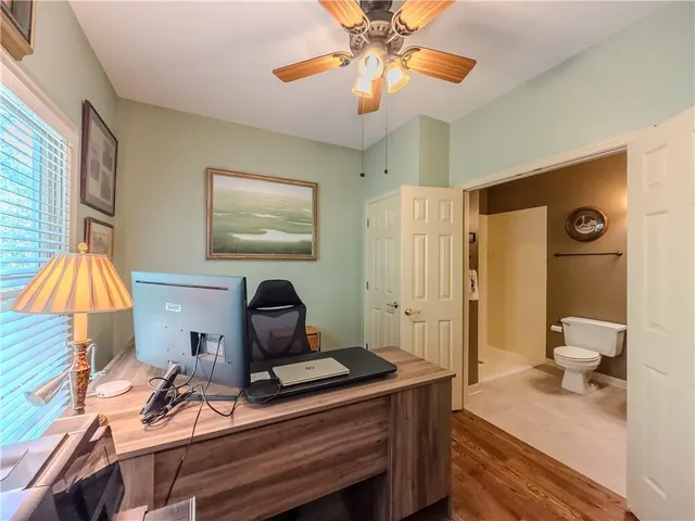 a spacious bedroom with a bed and a window