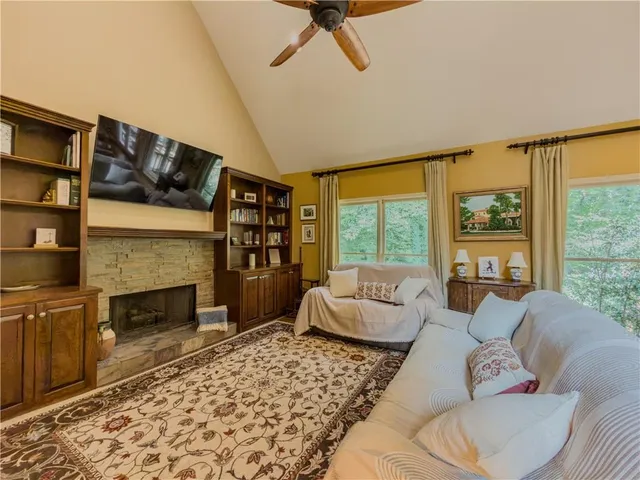 a spacious bedroom with a bed and a table in it