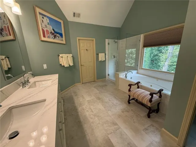 a bathroom with a sink vanity and a mirror