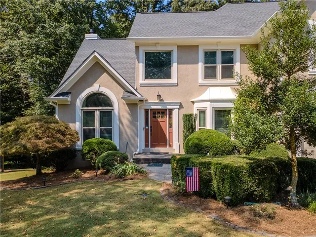 a view of a livingroom with furniture and workspace