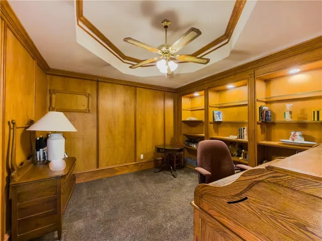 an aerial view of a house with a swimming pool
