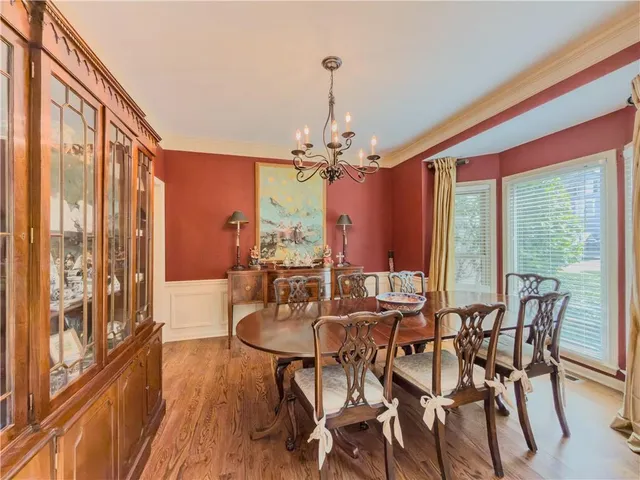 a kitchen with a sink a counter space appliances and cabinets