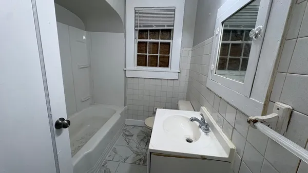 a bathroom with a sink and a tub