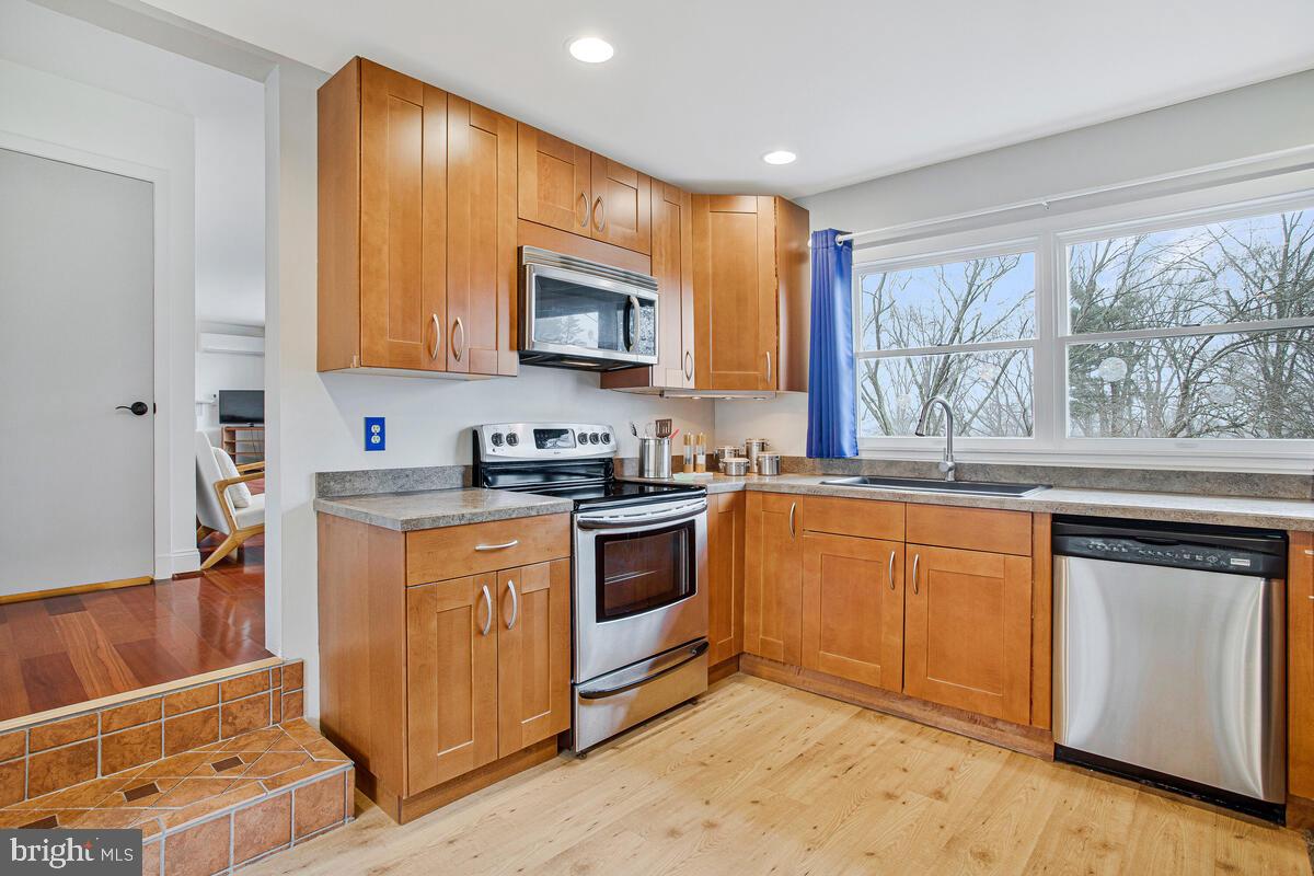 207 Hillendale Road Bel Air, MD 21014 - Photo 5 of 20 a kitchen with stainless steel appliances granite countertop a stove a sink and a microwave
