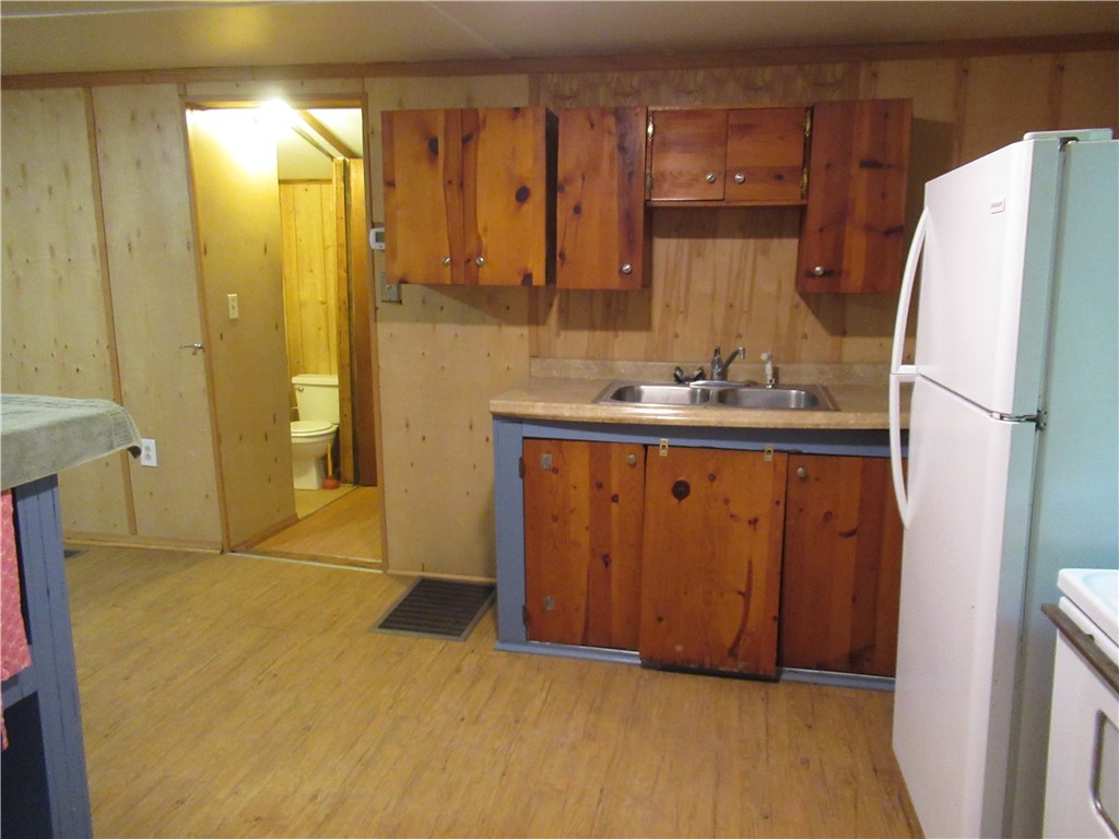 437 West Gate Road Pickens, SC 29671 - Photo 29 of 47 This cozy kitchen area features durable wood flooring and ample cabinetry for practical living.