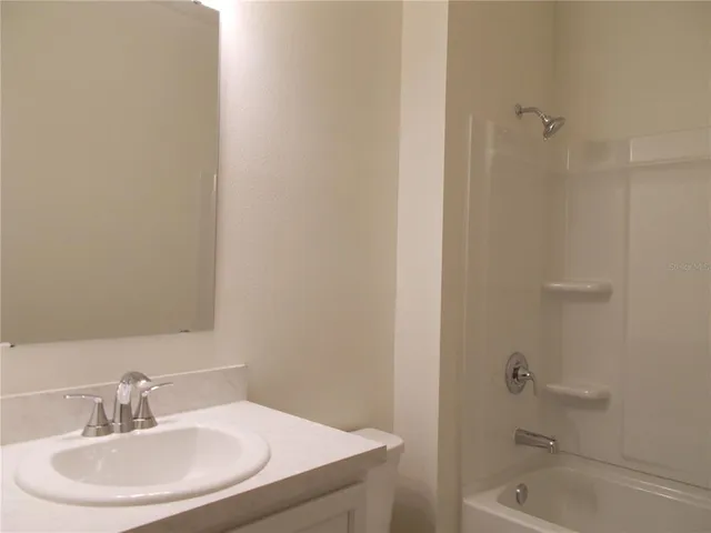 a bathroom with a sink and a bathtub