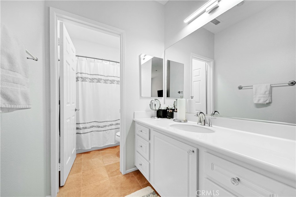 23 Carnation Irvine, CA 92618 - Photo 14 of 30 a bathroom with a double vanity sink mirror and