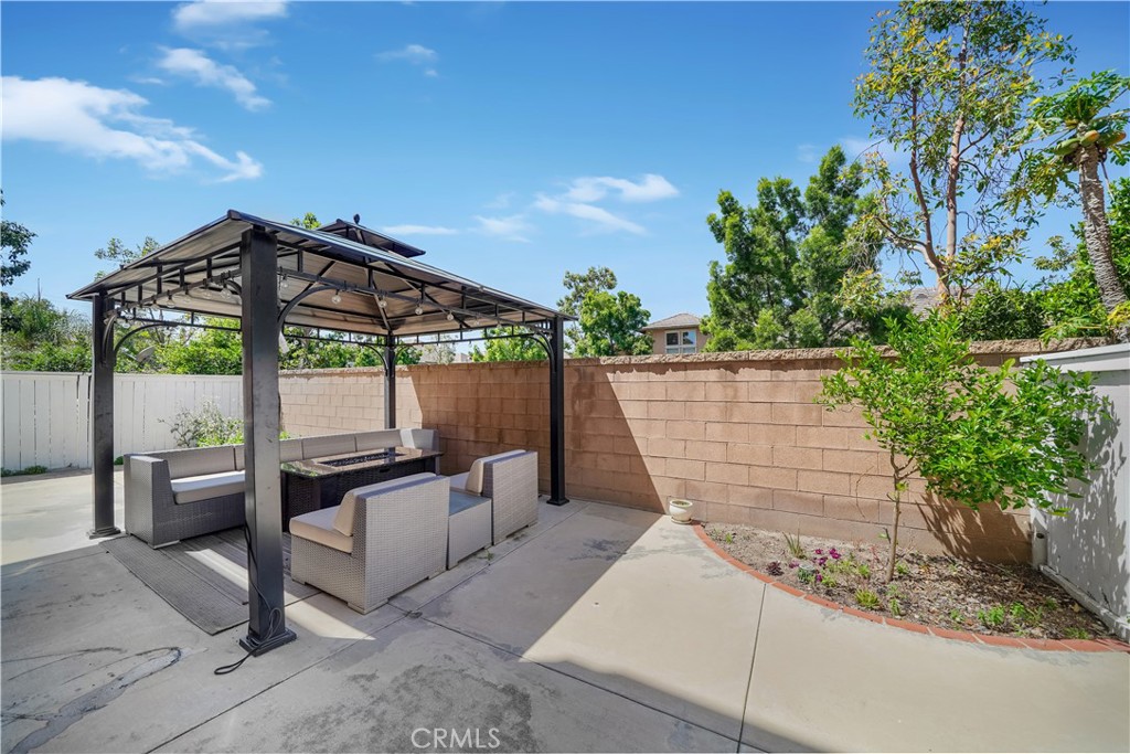 23 Carnation Irvine, CA 92618 - Photo 20 of 30 a patio with table and chairs and potted plants