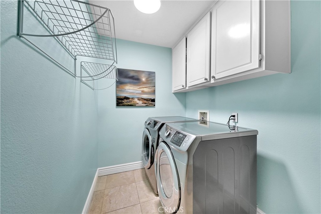 23 Carnation Irvine, CA 92618 - Photo 10 of 30 a utility room with dryer and washer
