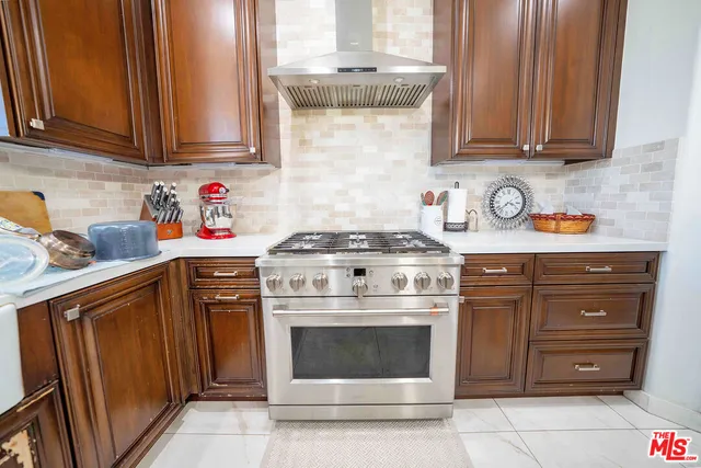 a dining room with furniture a chandelier and fireplace