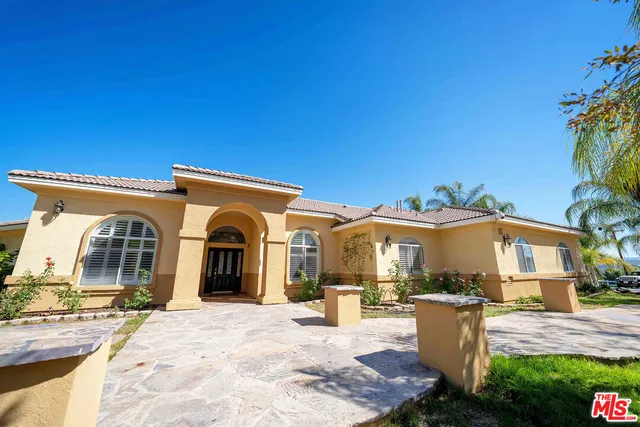a view of a house with a patio