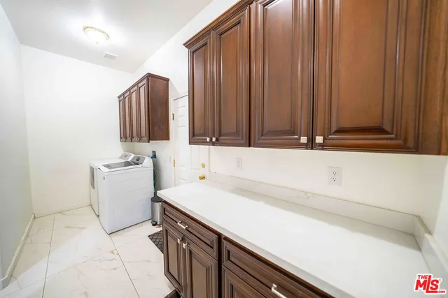 a living room with furniture and a mirror