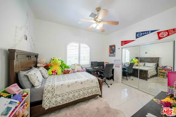 a bedroom with a bed and furniture