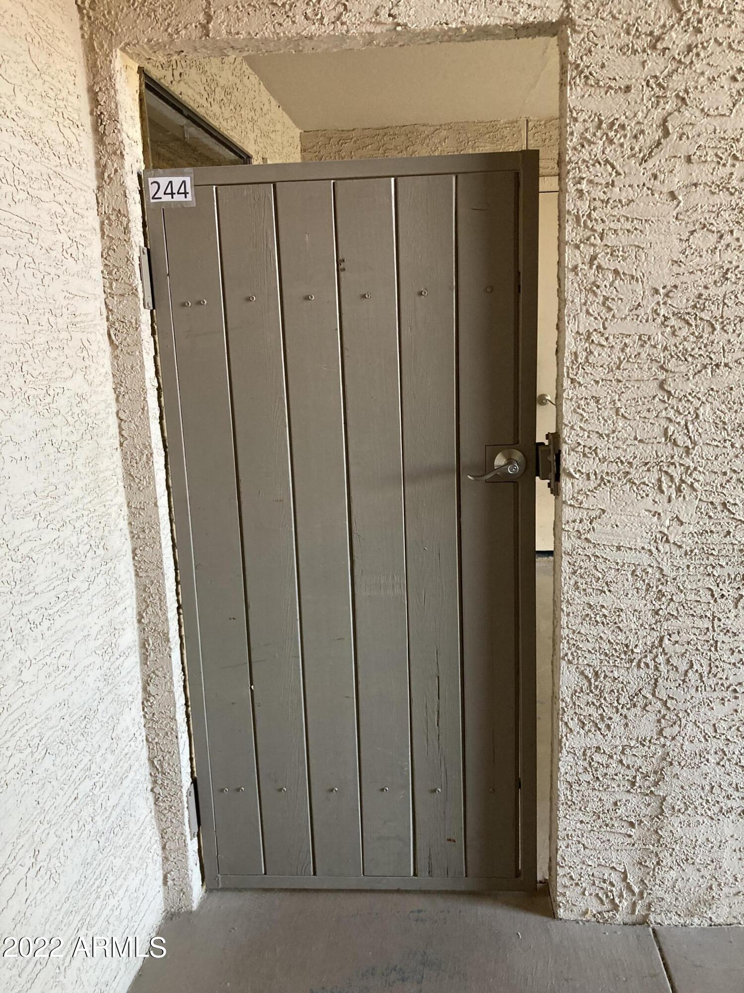 1340 North Recker Road, Unit 244 Mesa, AZ 85205 - Photo 26 of 34 GATED PATIO ENTRY