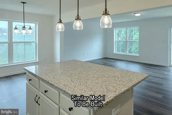 a view of kitchen and window in the room