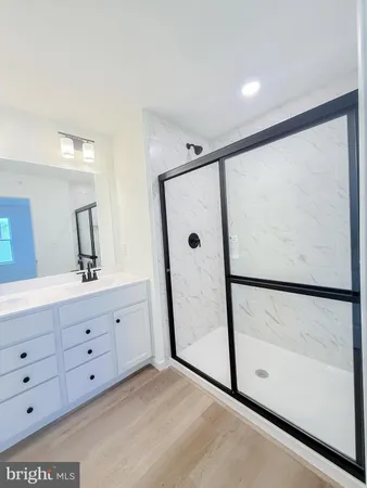 a bathroom with a double vanity sink and mirror