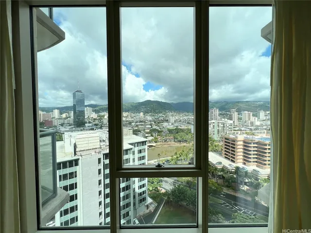 a view of a glass door with a view of the back yard