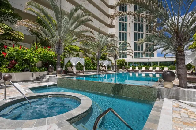 a view of a swimming pool with a patio