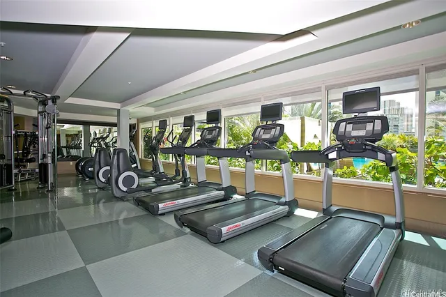 a view of backyard with a table and chairs and potted plants