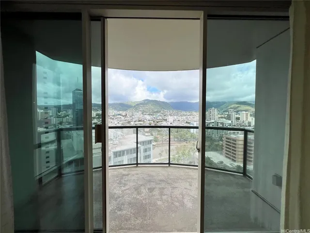 a view of a glass door with a yard from a window
