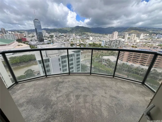 a view of a balcony with wooden fence
