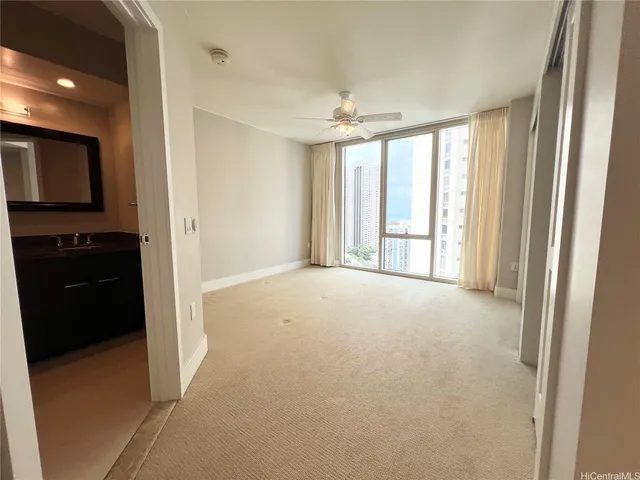 a view of an empty room with a window