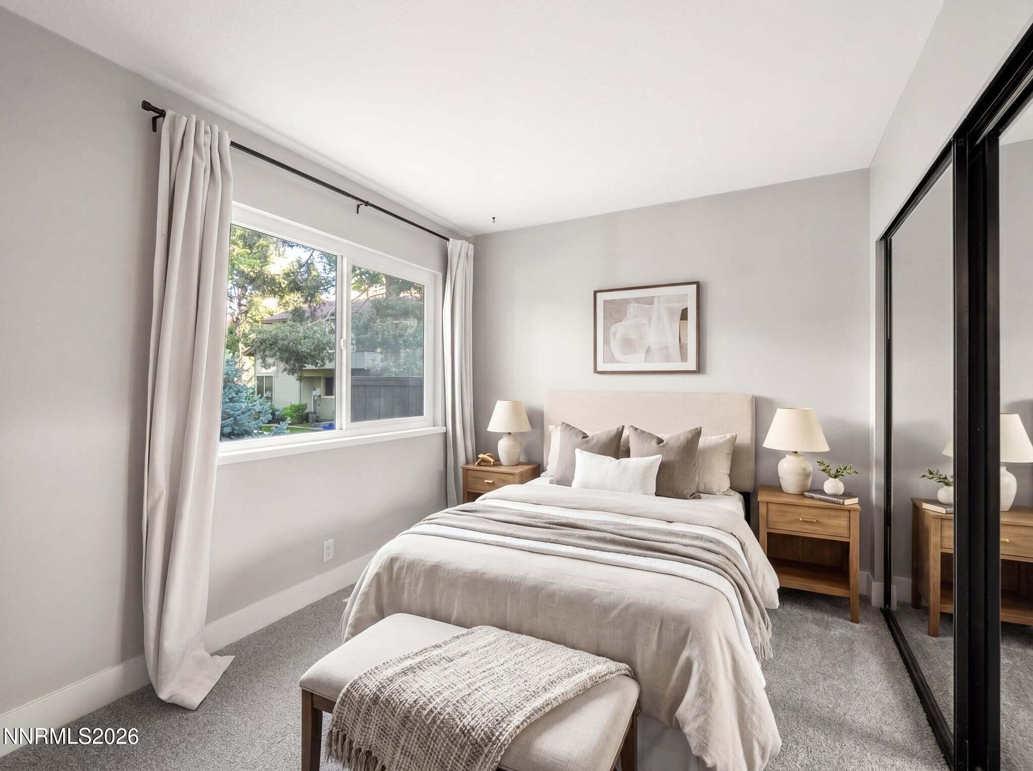 430 Angela Place Reno, NV 89509 - Photo 23 of 48 a bedroom with a bed and a large window