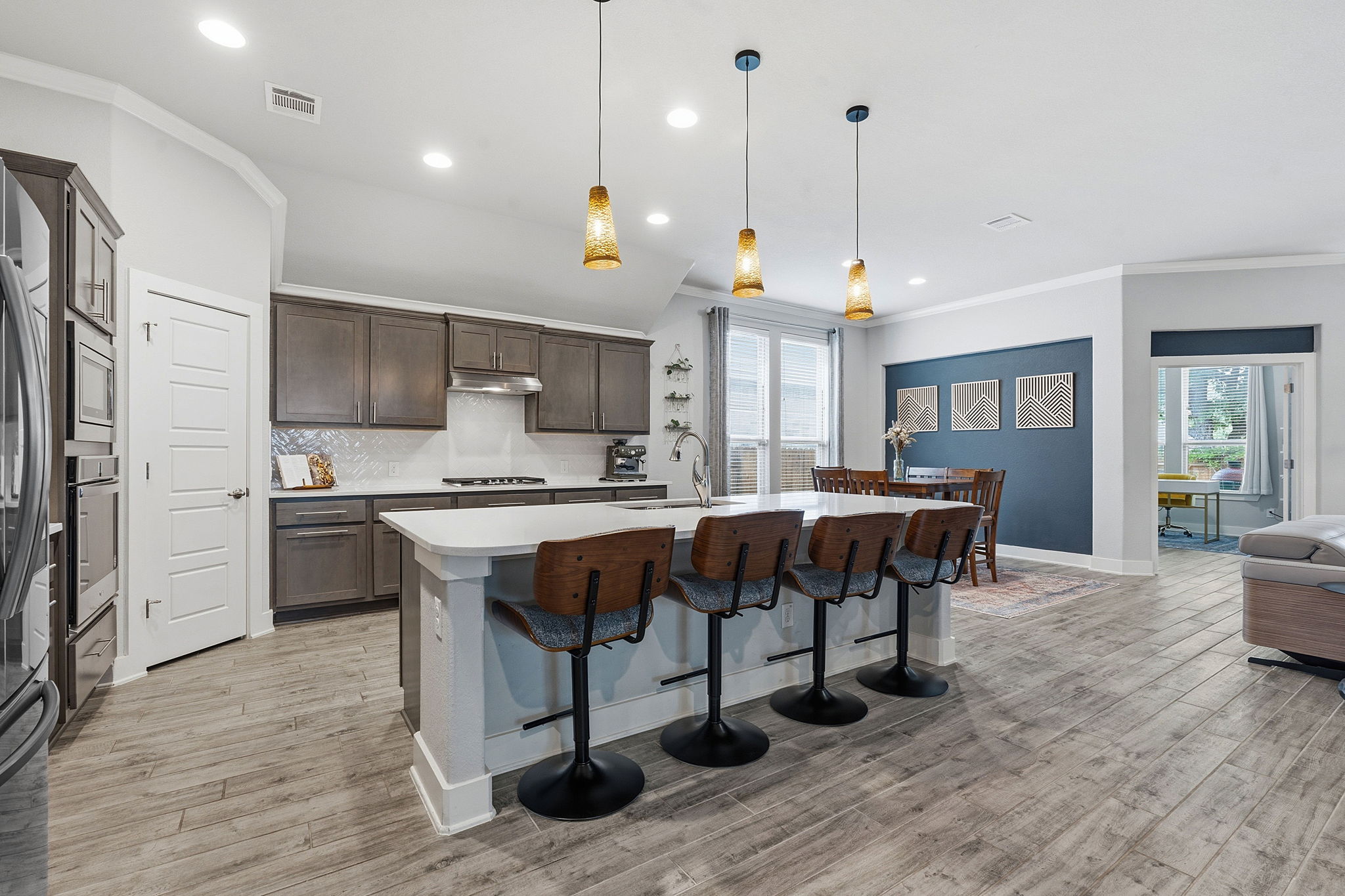 104 Red Granite Road Georgetown, TX 78633 - Photo 10 of 36 a large kitchen with a table and chairs