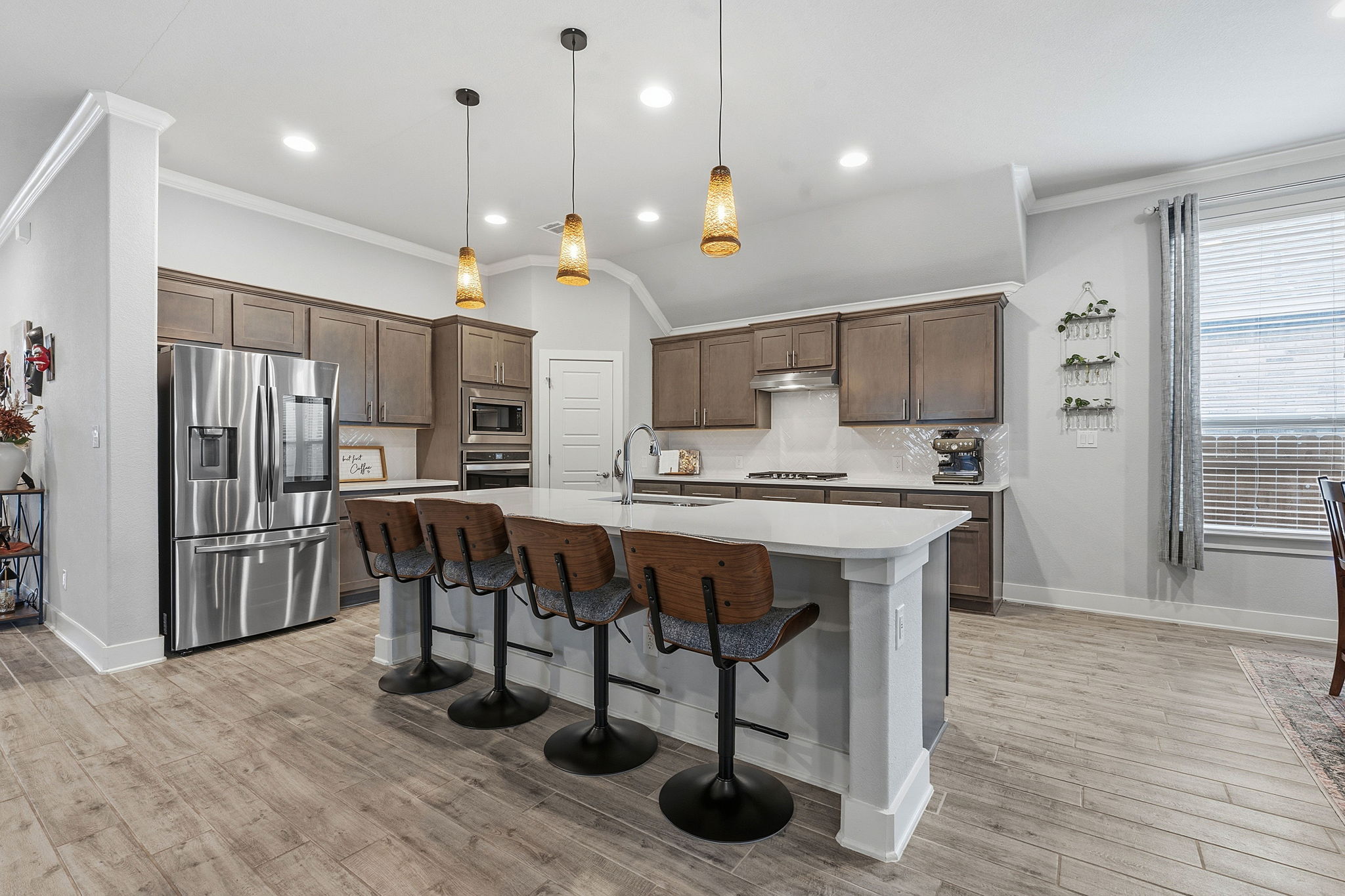 104 Red Granite Road Georgetown, TX 78633 - Photo 12 of 36 a large kitchen with a table and chairs