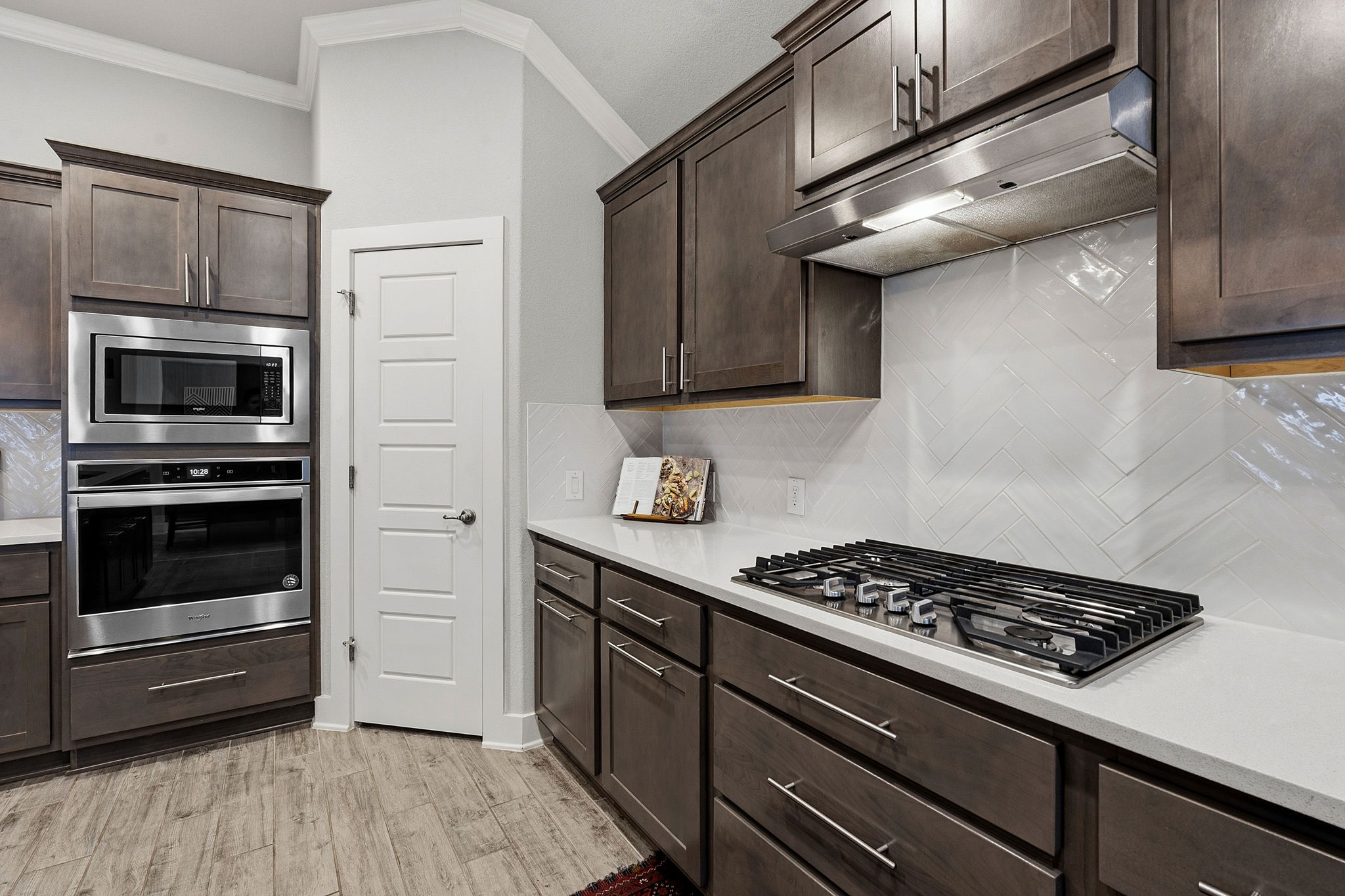 104 Red Granite Road Georgetown, TX 78633 - Photo 13 of 36 a kitchen with a stove and a microwave
