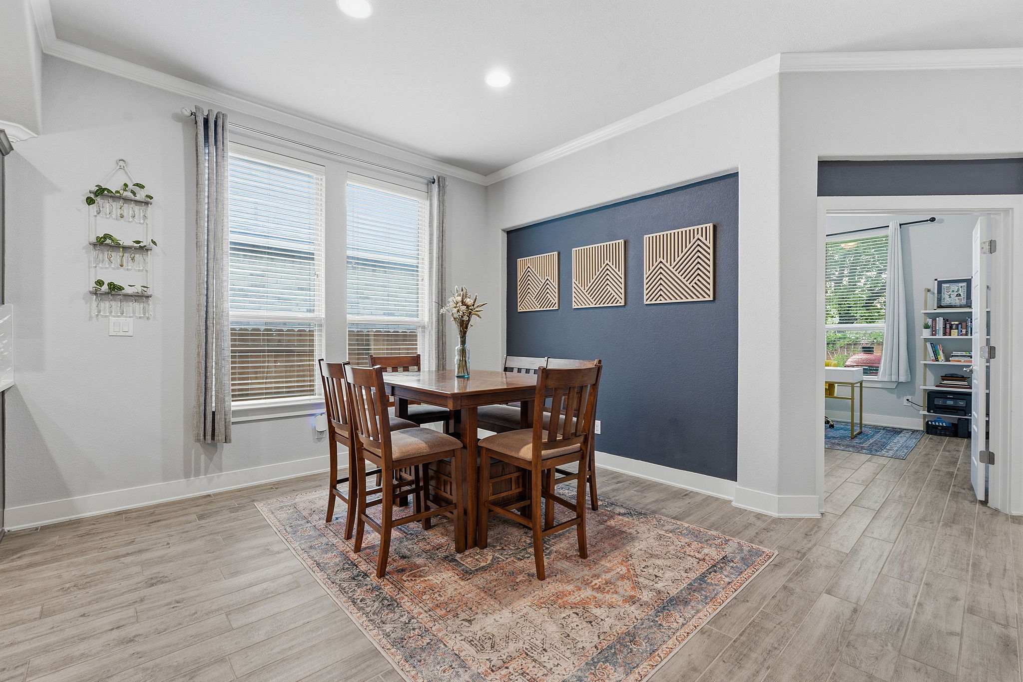 104 Red Granite Road Georgetown, TX 78633 - Photo 15 of 36 a view of a dining room with furniture and wooden floor