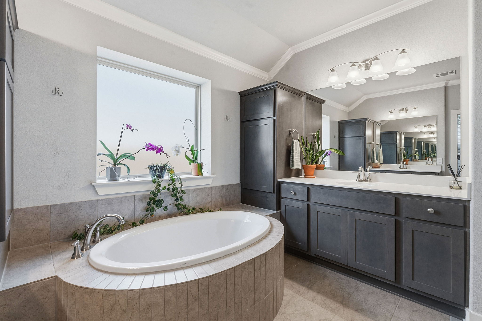104 Red Granite Road Georgetown, TX 78633 - Photo 21 of 36 a bathroom with a double vanity sink mirror and bathtub