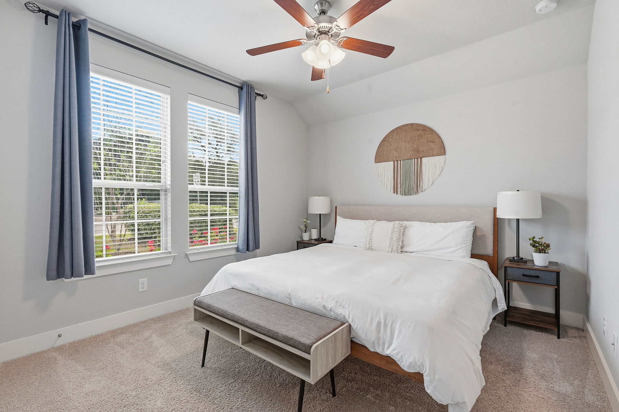 104 Red Granite Road Georgetown, TX 78633 - Photo 24 of 36 a bedroom with a bed and a chandelier