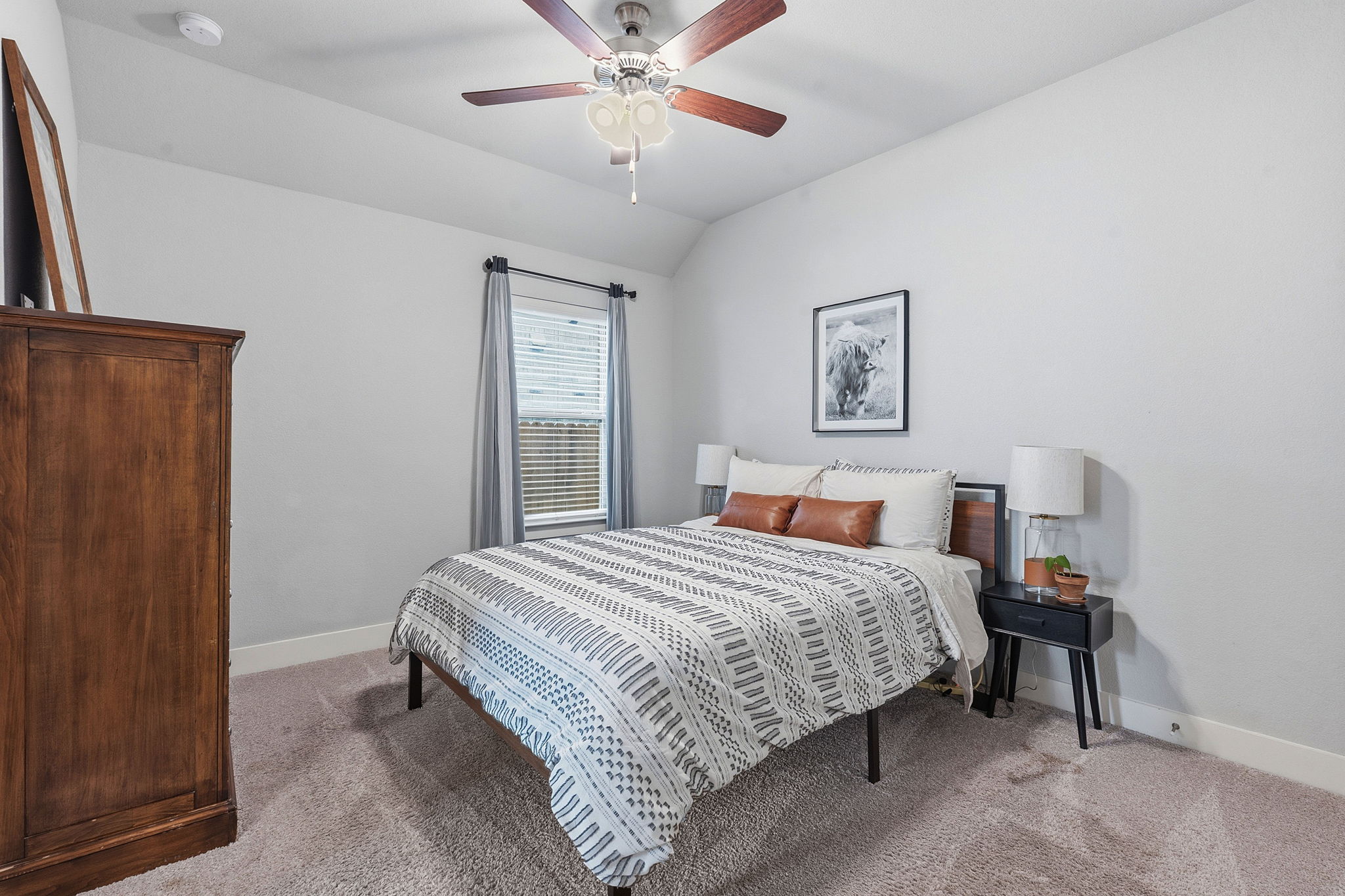 104 Red Granite Road Georgetown, TX 78633 - Photo 26 of 36 a bedroom with a bed and a chandelier